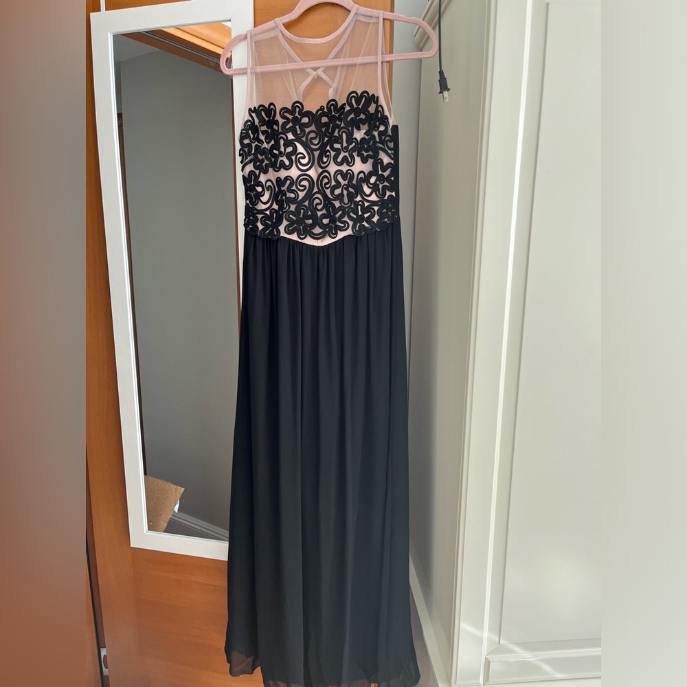 Black gown with floral appliqué